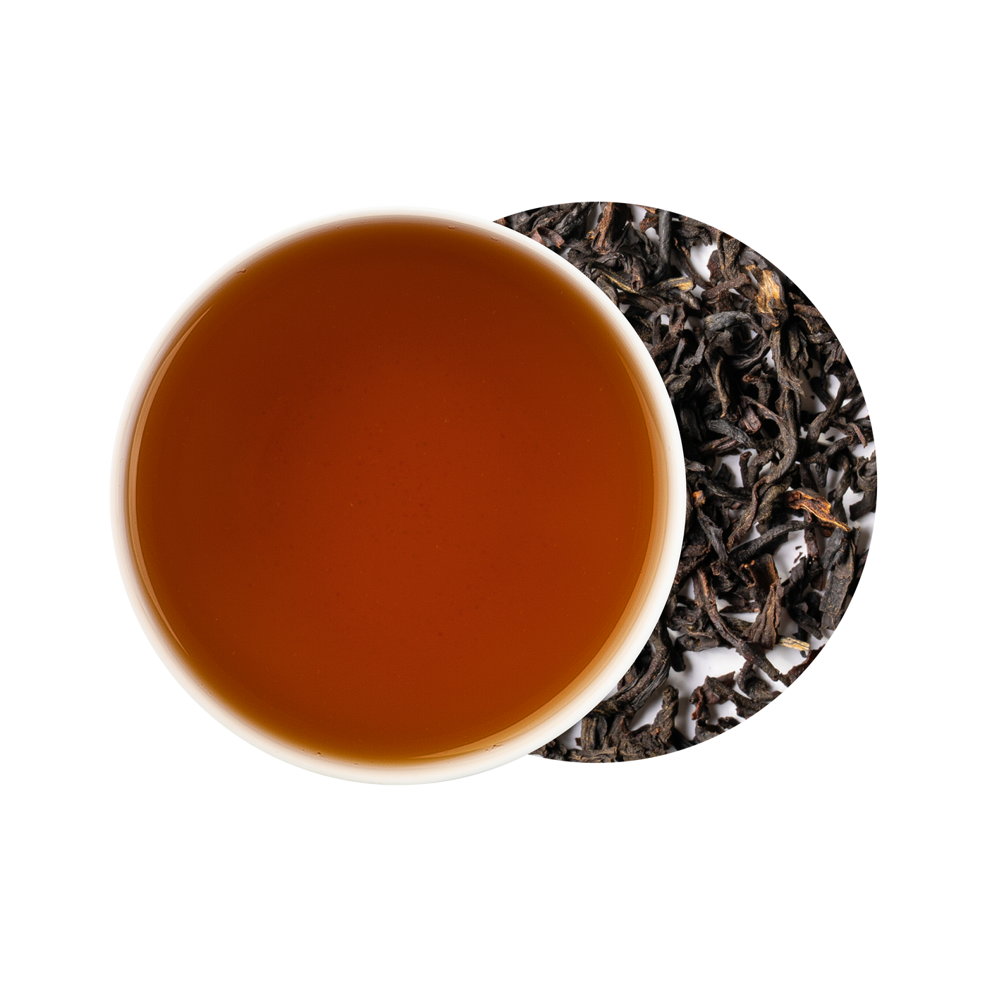 Tea cup with black tea leaves on a white background