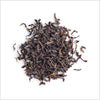 Circular pile of full leaf black tea.